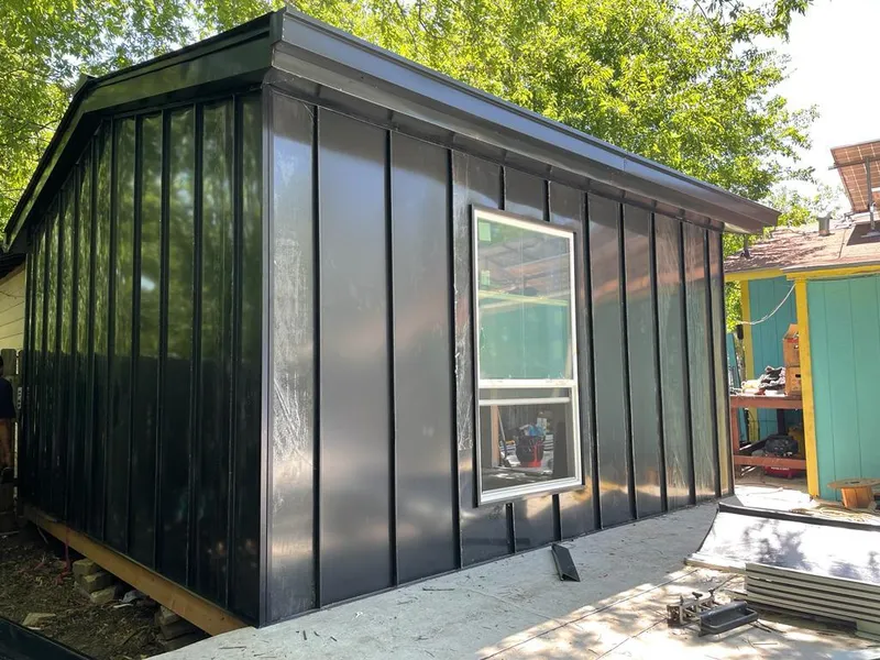 Black standing seam metal wall panels for Metal Roof Installation in South Lyon