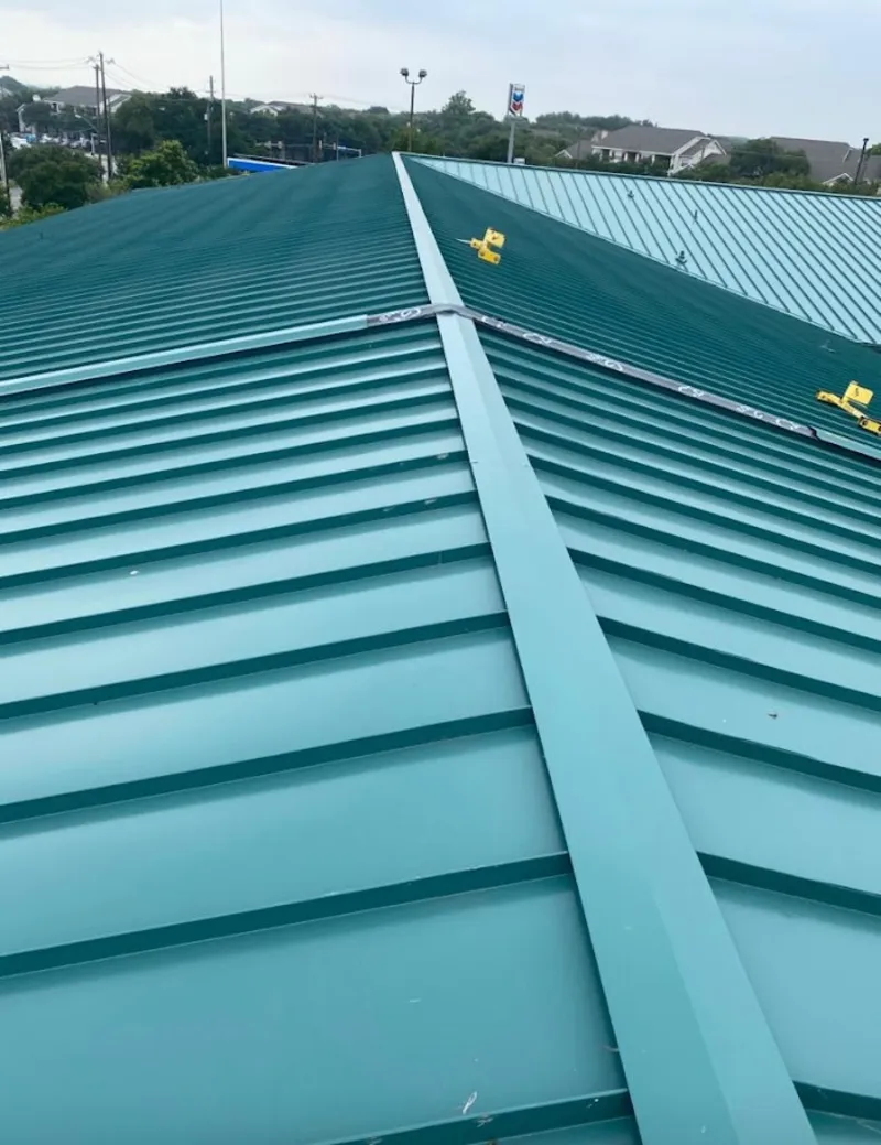 Green commercial metal roof ridge and valley for Metal Roof Repair in South Lyon